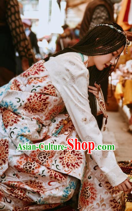 China Traditional Xizang Tibetan Minority Young Lady Clothing Zang Nationality Folk Dance Beige Brocade Robe
